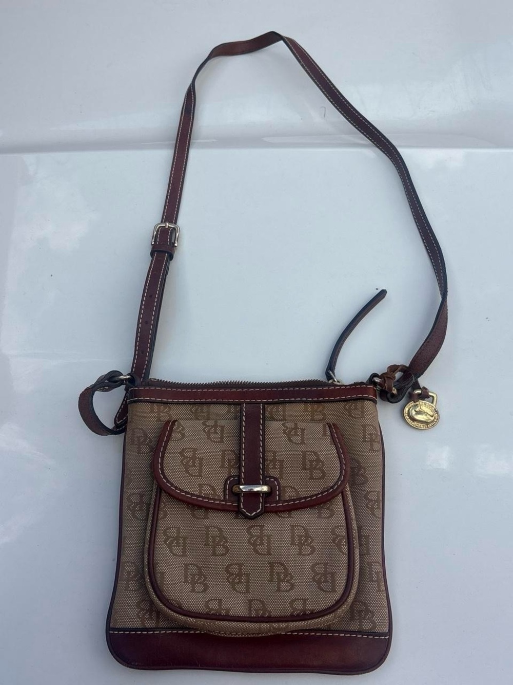 Dooney & Bourke Brown Monogram Crossbody Bag with Gold Charm